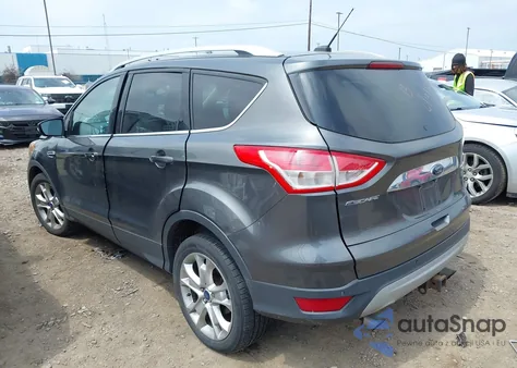 2016 Ford Escape Titanium z USA, uszkodzony, nr VIN 1FMCU9J93GUA62977